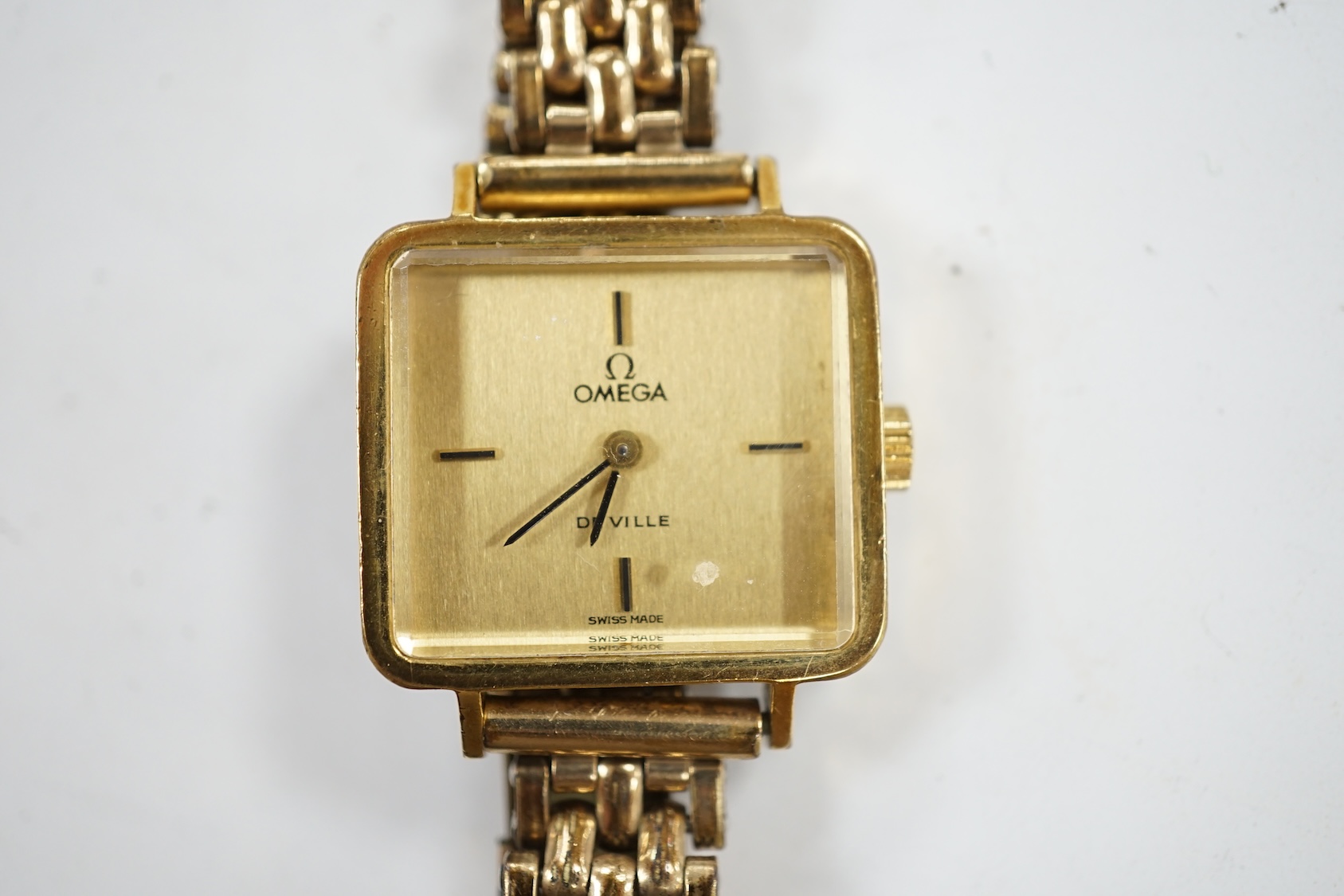 A lady's steel and gold plated Omega De Ville manual wind wrist watch, on an associated gold plated bracelet. Condition - poor to fair